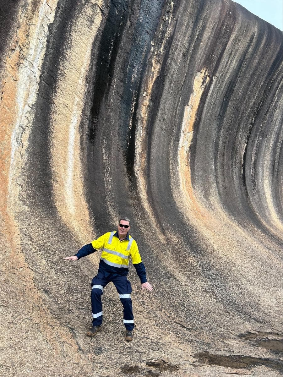 Robin surfing Wave Rock